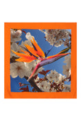 Load image into Gallery viewer, Silk scarf featuring an Orange Bird of Paradise with a White and Blue Cherry Blossom print, displayed as a flat lay to showcase its vibrant design.
