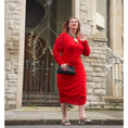 Load image into Gallery viewer, Women's Red Plus Size Boudicca Bodycon Midi Dress styled with quartz jewelry by Veronique Designs, black clutch, and gold Kurt Geiger sandals.