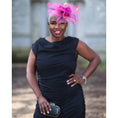 Load image into Gallery viewer, Women's Boudicca Summer Black Ruched Bodycon dress styled with a pink hairpiece, black and gold clutch for a stylish look.