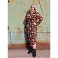 Load image into Gallery viewer, Women's Plus Size Orange Green Grey Camouflage Bodycon Midi Dress styled with black boots for a fashionable and edgy ensemble.