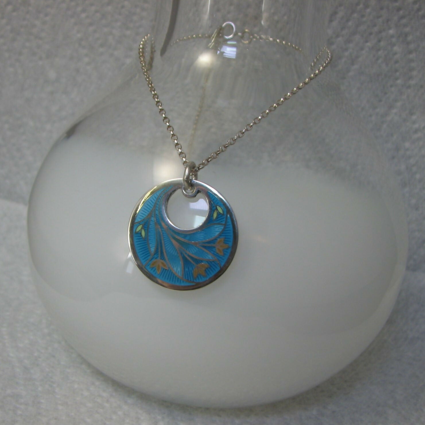 flower inspired vitreous enamelled sterling silver round pendant