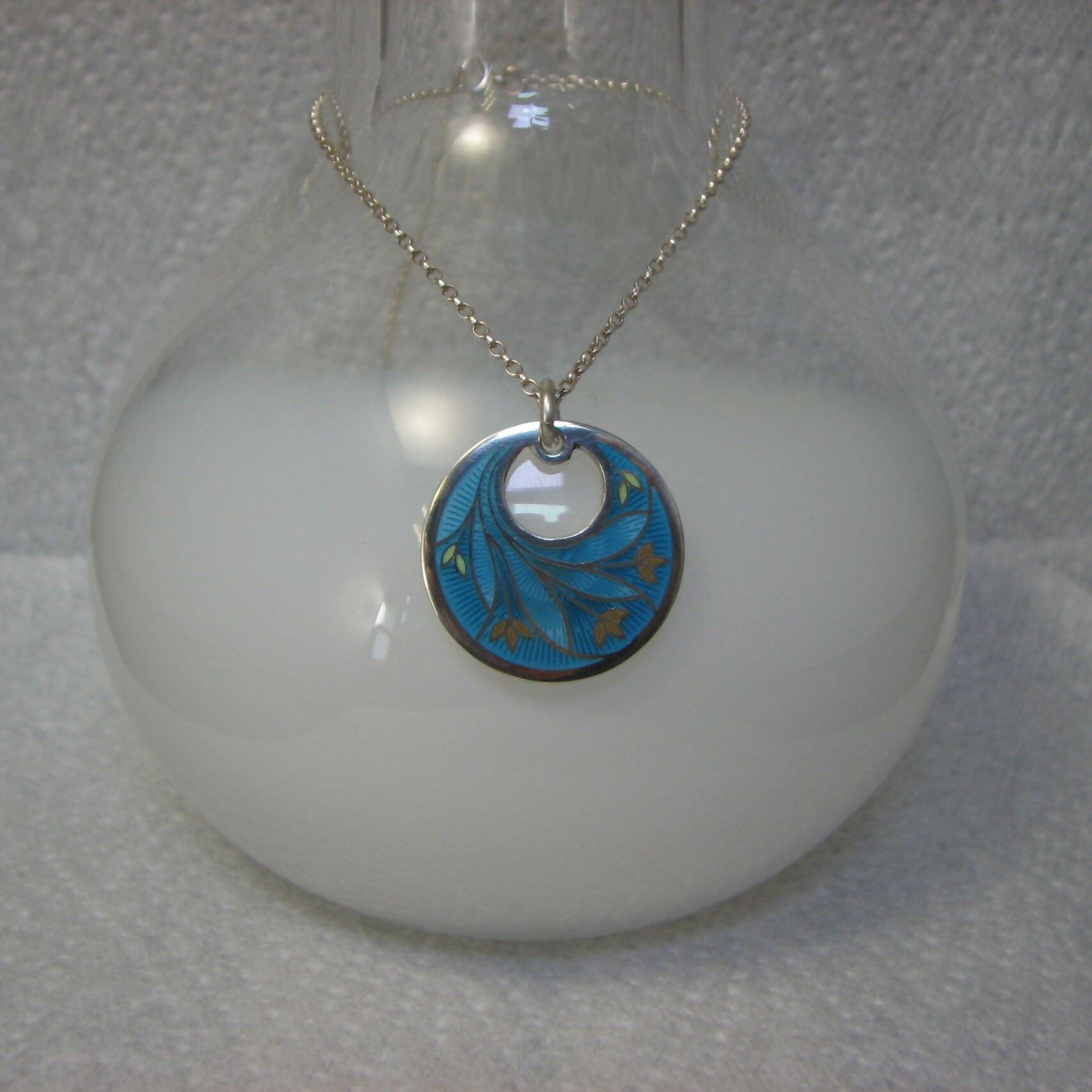 flower inspired vitreous enamelled sterling silver round pendant