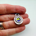 Load image into Gallery viewer, Hand holding a round handmade silver enamel pendant - MaisyPlum
