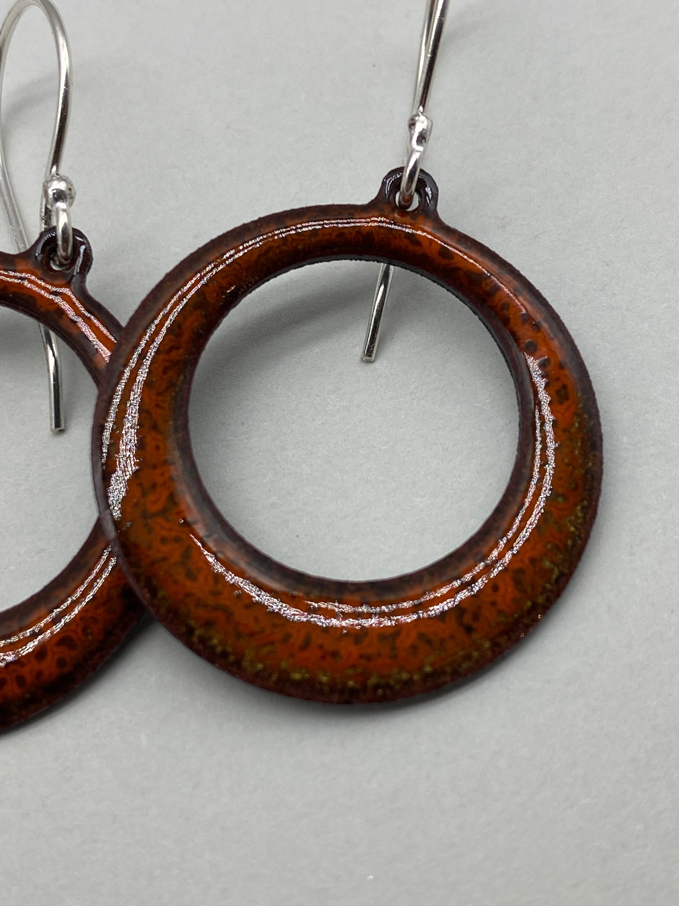 Orange enamel circle earrings close up - MaisyPlum