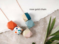 Load image into Gallery viewer, geometric-necklace-live-coral-terrazzo-sage-pink-teal-5ec40ec6-scaled.jpg.webp
